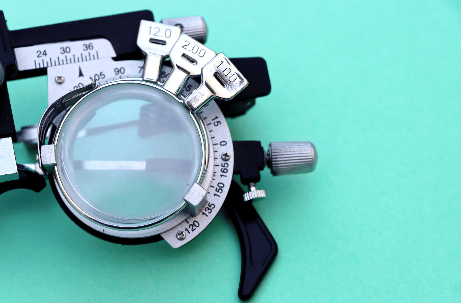 Half of a medical test glasses for high myopia with negative 15 diopters. This optician instrument contains three lenses on it
