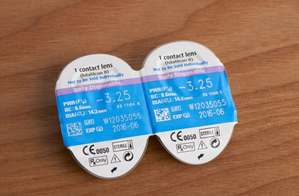 Packs of one-day-use contact lenses with an expiration date on the label.