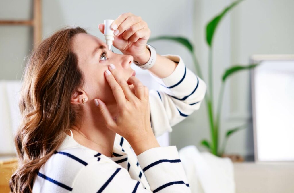 A contact lens wearer using rewetting drops to help moisturize their dry eyes