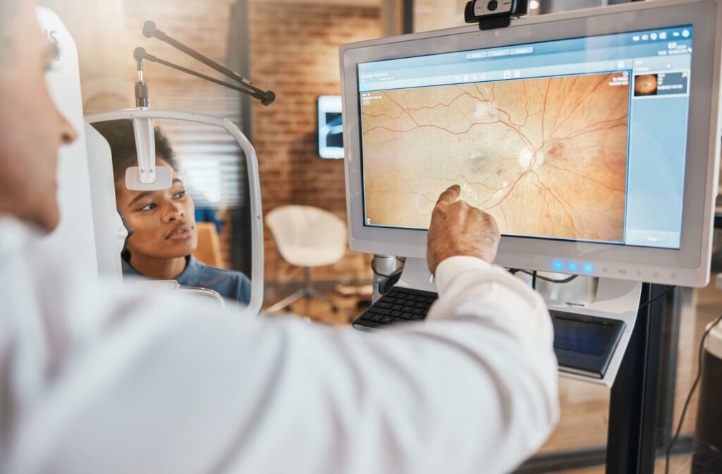  An optometrist discusses the findings of their patient's retinal images.