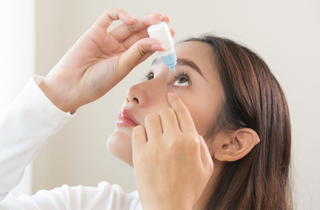 Adult using eyedrops to alleviate dry eye symptoms
